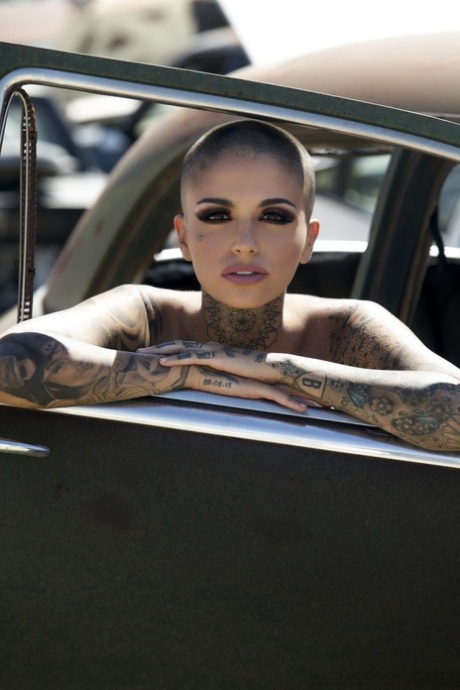 Bald Inked Babe Leigh Raven Flaunts Her Small Boobs And Poses Nude Outdoors