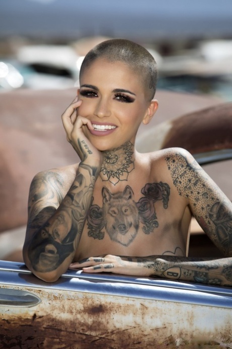 Bald Inked Babe Leigh Raven Flaunts Her Small Boobs And Poses Nude Outdoors