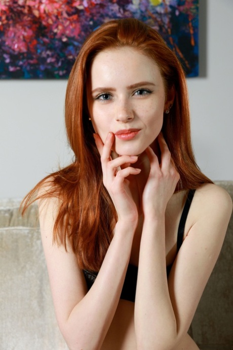 Redheaded Babe Bella Milano Reveals Her Innocent Body & Poses On The Sofa