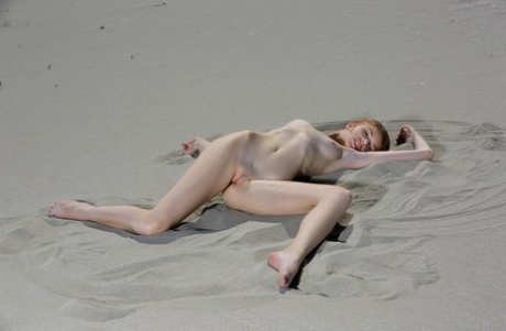 Adorable Russian Model Elle Tan Shows Her Pink Holes While Posing In The Sand