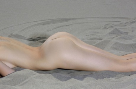 Adorable Russian Model Elle Tan Shows Her Pink Holes While Posing In The Sand