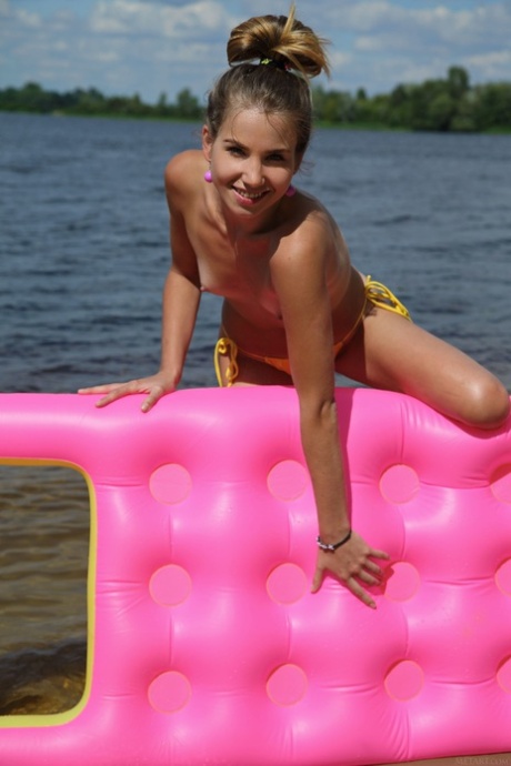 Ukrainian beauty Lola Krit puts on a floaty and flaunts her tits and holes.