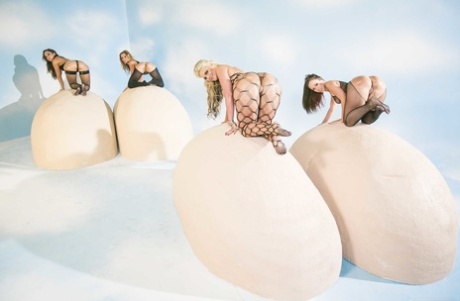 4 white chicks stack their big butts on top of one another in hose and heels