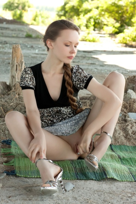 Russian teen Virginia Sun strips naked outdoors & reveals her slim body