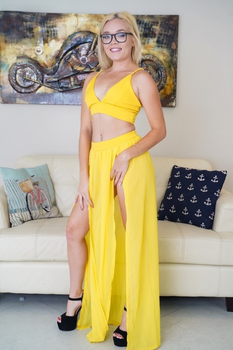 Blonde Katie Kush doffs her hot yellow dress to show her tiny tits & bald cunt