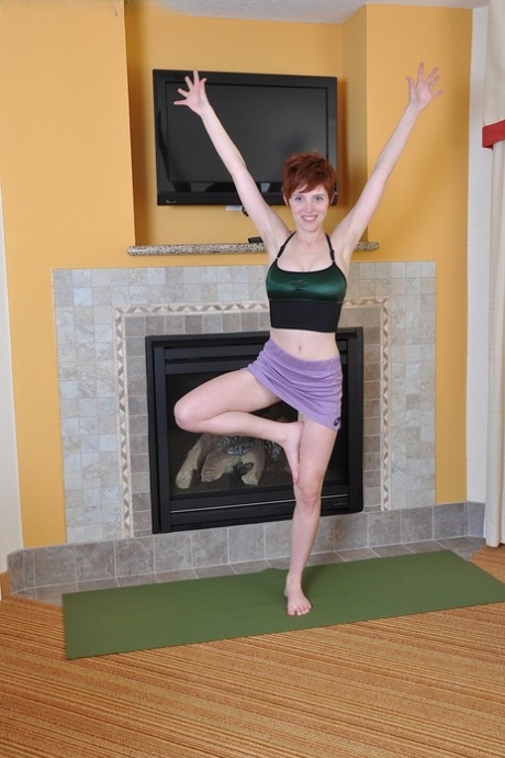 Ryanne's yoga poses involve the act of stripping naked and showing off her hairy pussy.