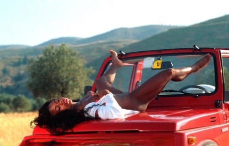 Afro-American Teen Diana-h Strips And Poses On A Jeep While Enjoying A Safari