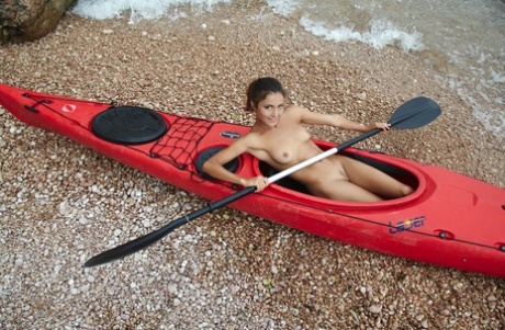 Sati displays her fully clothed genitalia while kayaking.