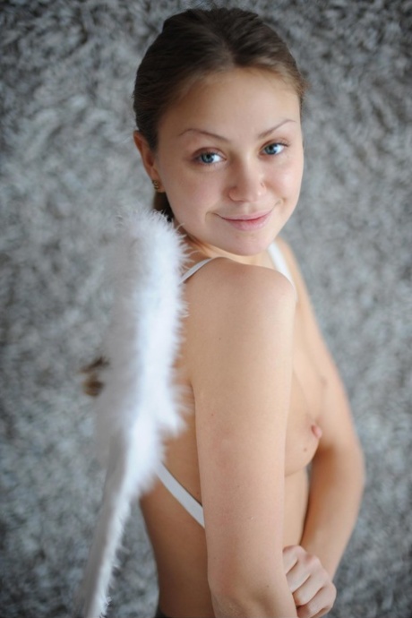 Liza, the petite angel, displays her tiny tits and dances in the nude while showing off her adorable belly.