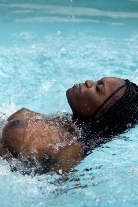 Glamorous Ebony Teen Deserea Bares Her Incredible Big Tits Poolside