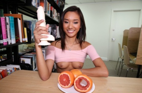 A bitchy: Teenager Alina Li bares her small buttocks and gobbles egg in the library.