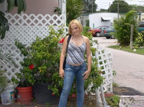 Sherri displays her oversized natural breasts while traveling in a van.