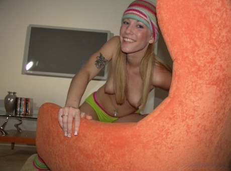 Blonde With A Hat Ariel Poses Topless And Plays With A Monster White Dick