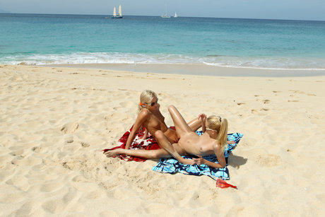 The girlfriend of blonde Franziska Facella is spotted at the beach and plays with her partner's vagina.