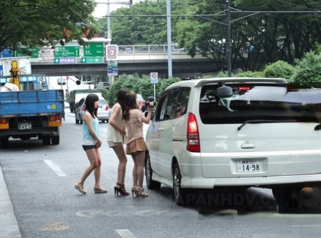 Three Japanese teens jump into a van and suck a tiny Asian dick