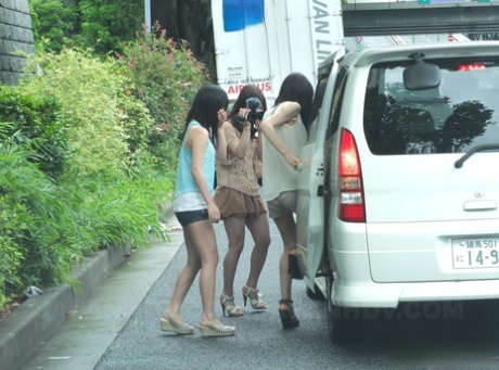 Three Japanese teens jump into a van and suck a tiny Asian dick