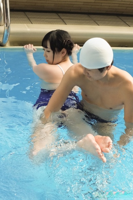 At the pool, Machiko Ono, a Japanese beauty, amazes her instructors with her swimming skills.