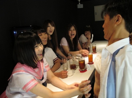 Mio Kosaki and her friends are sucking and kicking around in a bar, looking like an adorable Asian girl.