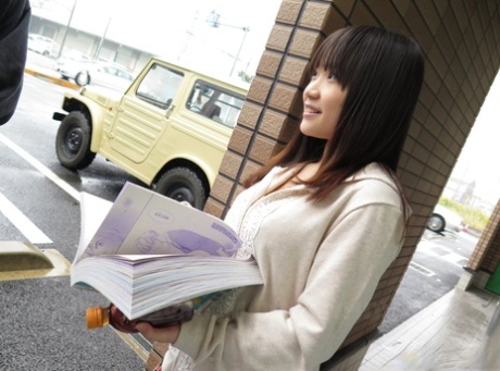 An unidentified man is given a blowjob by Japanese budding artist Mikoto Mochida, who performs the act in public.