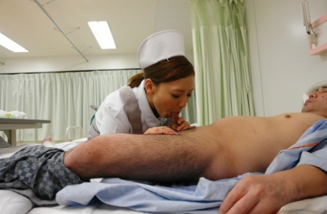 A horny old patient is fed by Japanese nurse Mio Kuraki, who enjoys giving him pleasure.