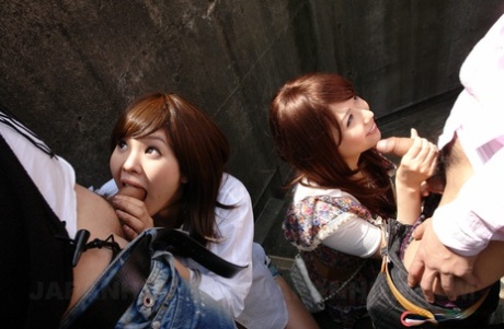 Rimu and Endo, two Asian brunette girls with breasts, engage in self-pleasure by performing oral sex on outdoor stairs.