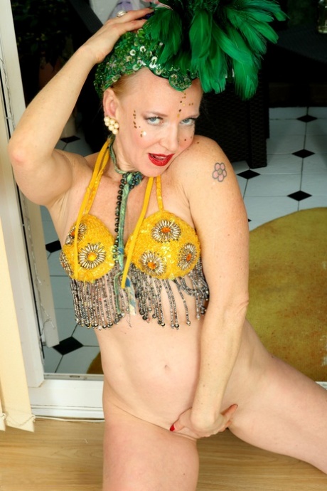 The charming miLF-like mouse disrobes in her sexy attire and toy her ample anal region.