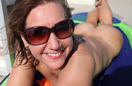 Horny Mature Lynn Flaunts Her Saggy Naturals And Poses Naked On A Boat