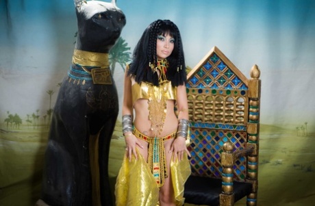 Bum and boo: Petite Asian Rina Ellis shows off her body in Cleopatra costume.
