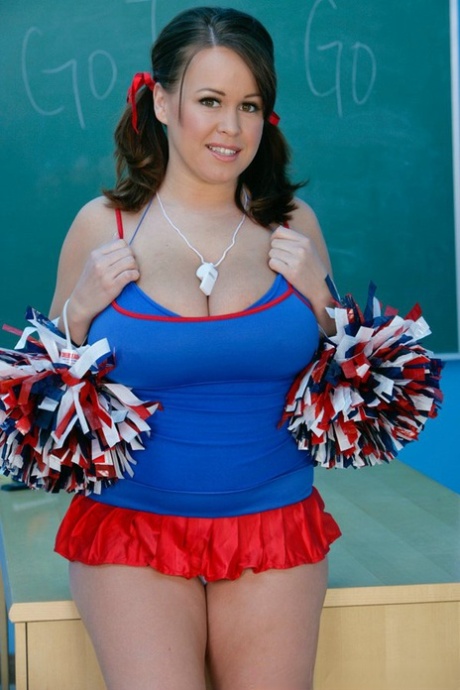 Naughty cheerleader Brandy Talore lets out her monster tits in the classroom - PornHugo.net