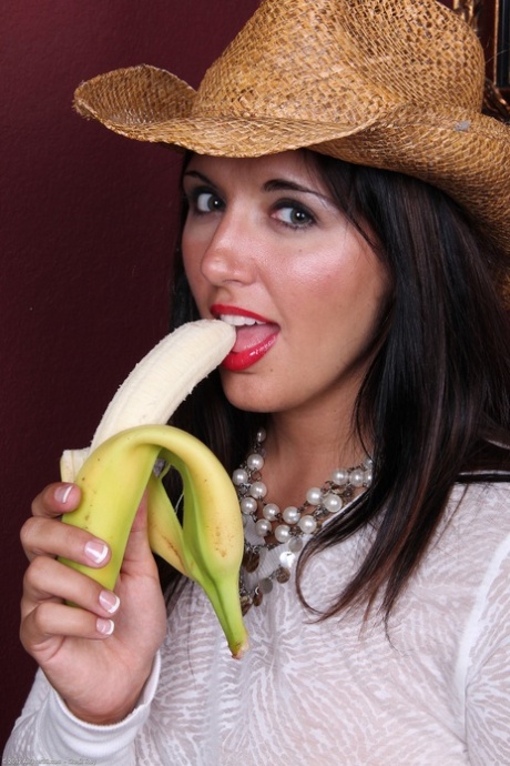 The brunette girl Toni holds a banana for her masturbation and breasts are impressively large.