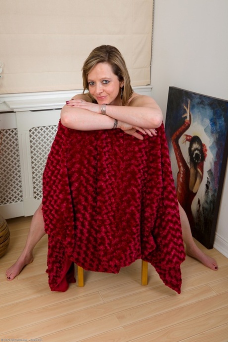 Silky Thighs Lou, an overweight mother, exposes herself naked and takes a seat on her chair.