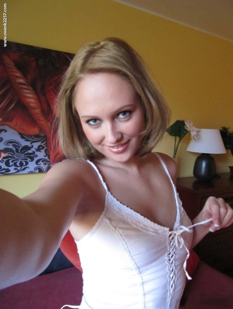 Blonde teen with sexy eyes Nolana taking selfies of her sweet tanned tits