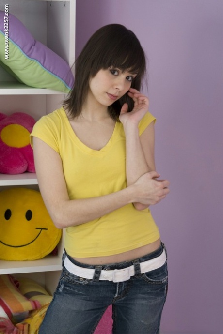 Posing in her yellow shirt and tight jeans, Ariel Rebel is also known as "petite MILF".