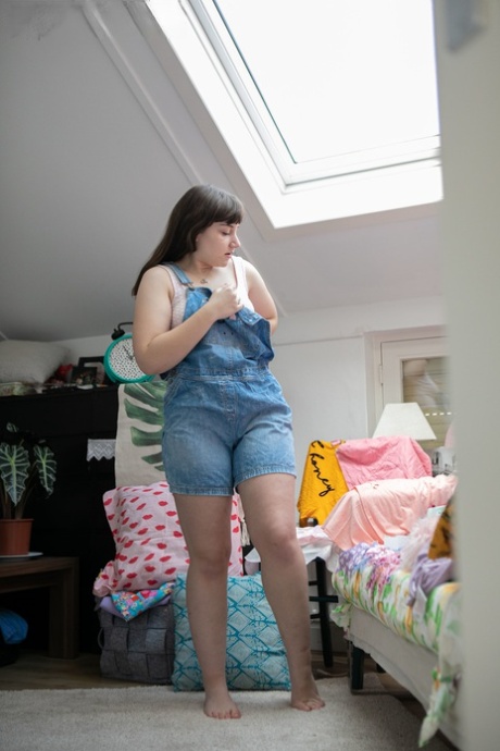 Young Kelsy, a little girl with pink lips and makeup, is caught on camera while wearing one of the jeans.