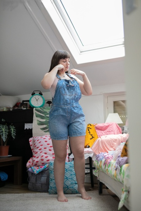 Kelsy, a little girl with freckles, is observed while wearing jeans and her tiny bodysuits.