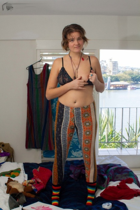 Her tits and hairy vagina are used by Sierra K, the tall and curvy, as she undresses and teases herself.