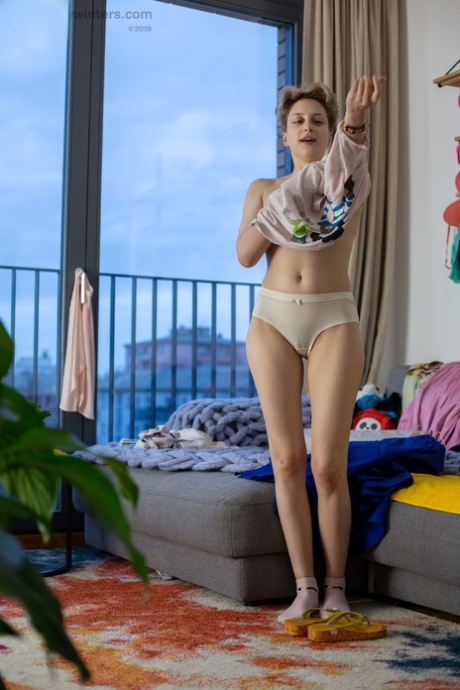 In her outfit, Liza K - who is an amateur blonde looking in at the moment - flashes her natural bush.