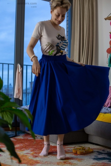 While getting dressed, Liza K showcases her natural bush as an amateur blonde.