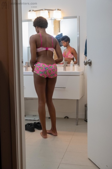 Skinny ebony with short hair Ashlee L dresses in undies & shorts in the toilet