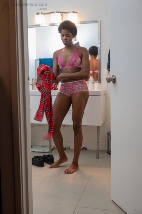 Skinny ebony with short hair Ashlee L dresses in undies & shorts in the toilet