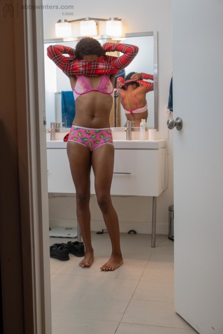 Skinny ebony with short hair Ashlee L dresses in undies & shorts in the toilet