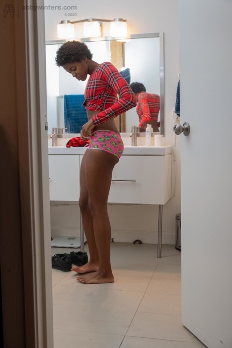 Skinny ebony with short hair Ashlee L dresses in undies & shorts in the toilet