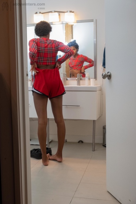 Skinny ebony with short hair Ashlee L dresses in undies & shorts in the toilet