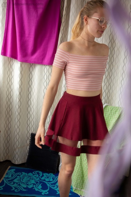 Skinny teen with adorable tiny titties Sophie S dresses in her red skirt
