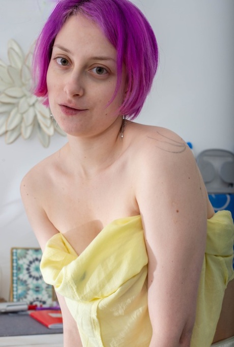 With her puffy nipples and natural bushming, Liza K, the purple-haired hottiful diva, is on full display.