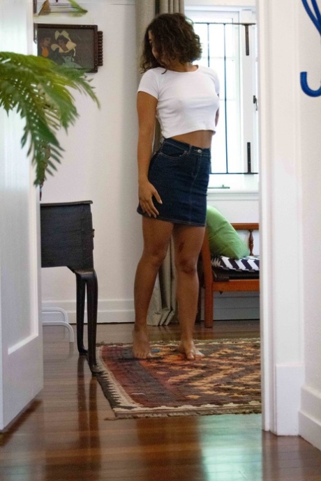 Skinny amateur teen Tilly B dresses in denim shorts and a white shirt