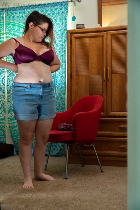 Liar with glasses: Chubby amateur Hannah J, right; denim shorts and sweet shirt.