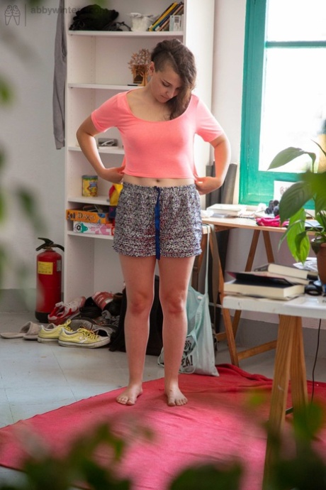 Before wearing clothes, Pascal displays her unaltered tits and pudgy vagina.