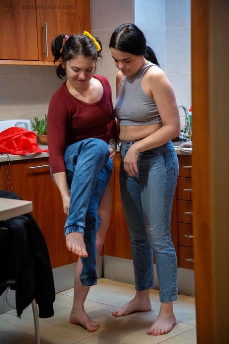 Dasha D and Nina B, both young girls with black hair, donning jeans on their promenade.