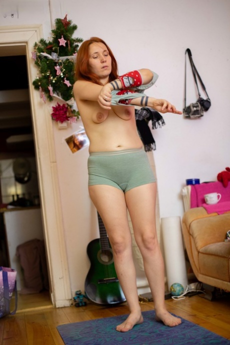 Ginger teen with small tits Simona gets spied on while dressing